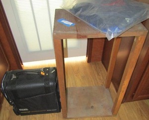 lot 109 image: Locker rolling bag, bag of BBQ cook off aprons, 32x18x13 wood plant stand