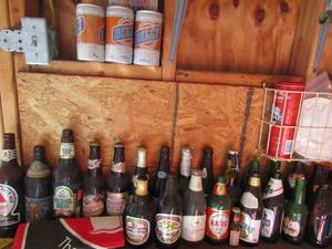 lot 5 image: Vintage collection of Beer Bottles (Lowenbrau, Munchen, Michael Sheas, grand Prize beer, Falstaff)
