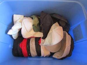 lot 162 image: Blue tub full of BBQ Snap Back Caps