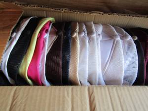 lot 168 image: Box of snap back caps