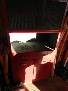 lot 9 image: Red metal cabinet - 2 doors, top has slide doors,  63 x 30w x 14
