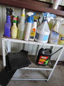 lot 182 image: 3 tier shelf with contents (cleaning supplies, coolant, Epsom salts and more)