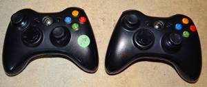 lot 39 image: PAIR OF XBOX 360 GAME CONTROLLERS