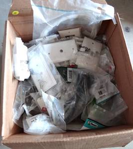 lot 78 image: LARGE BOX OF ASSORTED FACEPLATES & OTHER NIP PARTS
