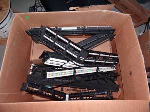 lot 299 image: LARGE BOX OF PATCH PANELS AND FACEPLATES AS SHOWN