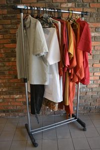 lot 654 image: Rolling Garment Rack with Clothes, see Pictures