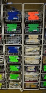 lot 557 image: Elfa Basket Storage Racks, 2 Racks each holds 8 Baskets CONTENTS SOLD SEPARATELY