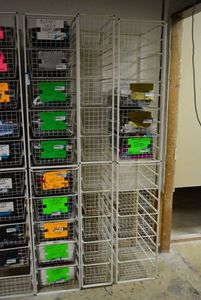 lot 570 image: Elfa Basket Storage Racks, 3 Racks each holds 10 Baskets, one is narrower CONTENTS SOLD SEPARATELY