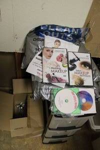 lot 961 image: Inspire Makeup DVDs, 3 Drawer Plastic Storage Bin, Tight Collar Disposable Wraps. And Hangers as shown