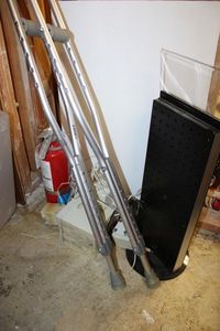 lot 989 image: Misc. Lot Crutches, Spinning Displays Stand, Fire Exstinguisher and Cambridge Sound System