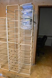 lot 591 image: Elfa Basket Storage Racks, 2 Racks each holds 10 Baskets CONTENTS NOT INCLUDED CONTENTS SOLD SEPARATELY