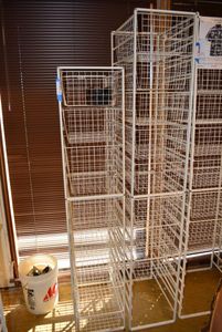 lot 596 image: Elfa Basket Storage Racks, 2 Racks 1 Holds 10 Baskets and 1 Holds 8