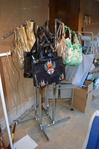 lot 1020 image: Display Rack Plus Bags as shown