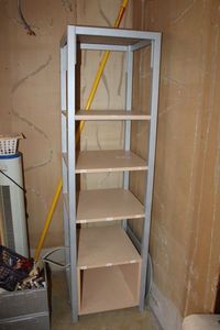 lot 1057 image: 4 Shelf Square Display Unit, 6 Ft. Tall, All One Piece, Does not come apart