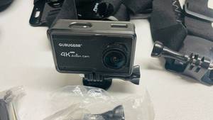 lot 7 image: GuruGear 4K Action Camera w Battery and Accessories (Works)