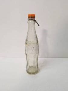 lot 14 image: Vintage Coke - Coca Cola glass bottle with flip top