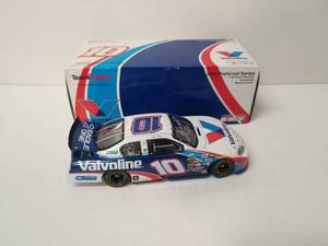lot 21 image: 2005 Team Caliber Valvoline #10 - 124 scale diecast - Steve Riggs - signed - Authenticity unknown