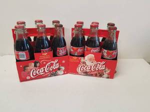 lot 83 image: Selection of 2 Christmas Coca Cola 6 packs