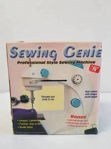 lot 184 image: Sewing Genie in box appears un used
