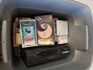 lot 192 image: Bin of VHS movies and a Sony VHS player
