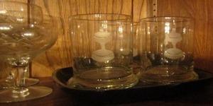 lot 26 image: 3 Couroc Delmas glasses, 6 wheat design wine glasses, 2 lemon glasses and 4 holiday etched glasses