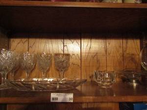 lot 30 image: Glassware lot- leaf divided dish, 4 pressed glass glasses, 12 point ash trays and globe