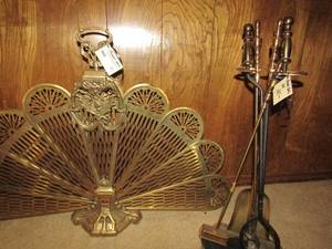 lot 51 image: Brass fan cover for fire place 27x37 and brass fireplace tool set