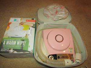 lot 53 image: Prince Lion heart baby wipe warmer used in original box, Sears pink hair dryer in case used Works great