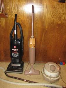 lot 54 image: Hoover Breath easy vacuum and older GE electric vacume with attachments