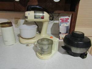 lot 59 image: Mr. Coffee single cup, Vintage Montgomery Ward mixer (works) East turn cheese grater Black and Decker mini chopper, Sunbeam egg cooker