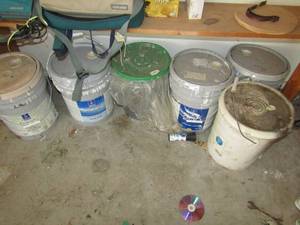 lot 147 image: Opened buckets of primer, Drywall and sealer