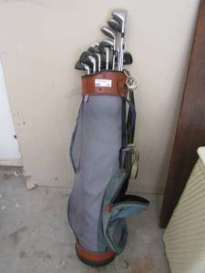 lot 165 image: Gray & brown golf bag with assorted clubs - Bombshell drivers  & Pinseeker Irons,