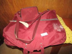lot 171 image: Red hanging bag carry on and pink knitted blanket