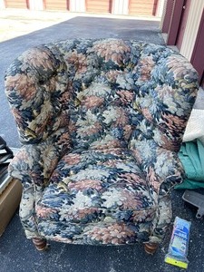 lot 182 image: Baker Furniture Company  Oversized  Club  Chair with floral pattern, very comfortable on brass wheels