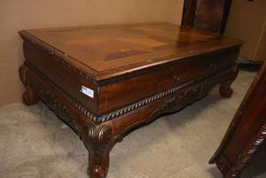 lot 18 image: Coffee Table Features Dual Star Veneer Top, Carved Wood Trim and 2 Drawers