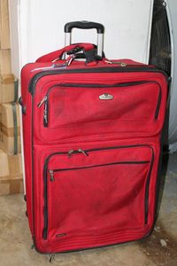 lot 120 image: Ricardo Beverly Hills Red Luggage