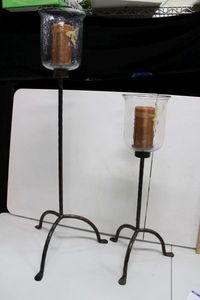 lot 87 image: Home Dcor Pair of Floor Standing Candle Holders with Hurricane Glass and Wrought Iron Stands 39 and 27 in Height, Globe is 7 Wide