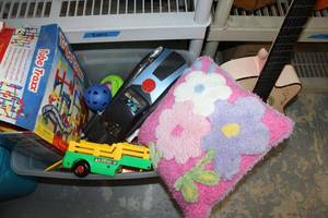 lot 214 image: Toy Lot Plush Flower Pillow, Mr. Incredible and Car, Tube Trax, Play Guitar and More