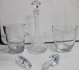 lot 218 image: Barware. Includes (2) Ice buckets, decanter stoppers and a crystal decanter. (1) is a Vera Wang for FTD Ice Bucket. 7.5H
