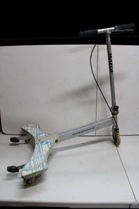 lot 255 image: Razor Powerwing Battery Operated Scooter (White and Blue Colors)