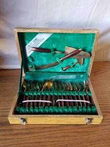 lot 70 image: Jims Gems bronze factory flatware set in case