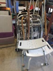 lot 142 image: Selection of walkers, shower seats, crutches - some appear un-used