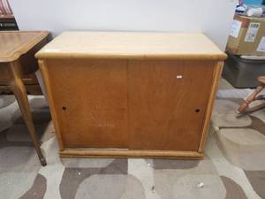 lot 187 image: Wood cabinet with slider doors - 12 by 40 by 30