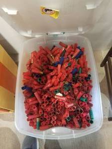 lot 196 image: Bin full of spent shotgun shells and some clay targets