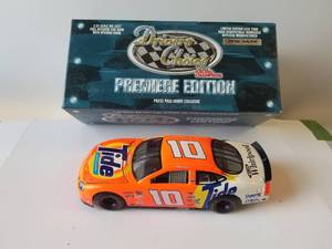 lot 26 image: Racing Champion Ricky Rudd 124 Tauras - Tide Press Pass Hobby Exclusive