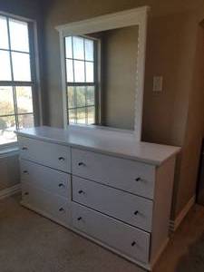 lot 94 image: White bedroom furniture, dresser with mirror, nightstand, entertainment center, and a full-size bedframe