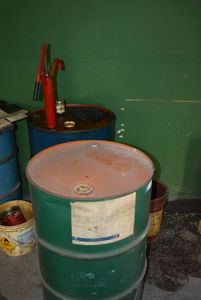 lot 107 image: 55 Gal Barrel with Pump and Barrel of Tween 20