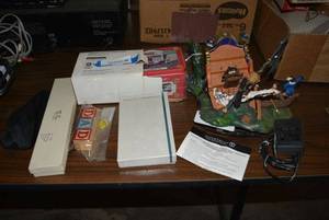 lot 181 image: Bianca Gold Bifocal Sunglasses, Perry Ellis Travel Razor Kit, Wooden Blocks, Fashion Watch, 1913 Ford Model T Model Truck, Pirate Ship Toy