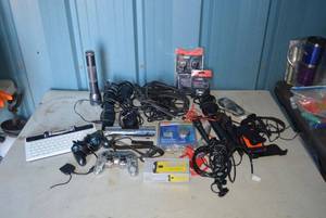 lot 13 image: Misc. Electronics Samsung Keyboard, Game Controllers, Gigaware Serial Cable and Coupler still in packaging, Microphones, Phone cases and More