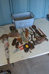 lot 15 image: Misc. Tools Badger Garbage Disposal, Sledgehammer needing new Handles, Clamps and More